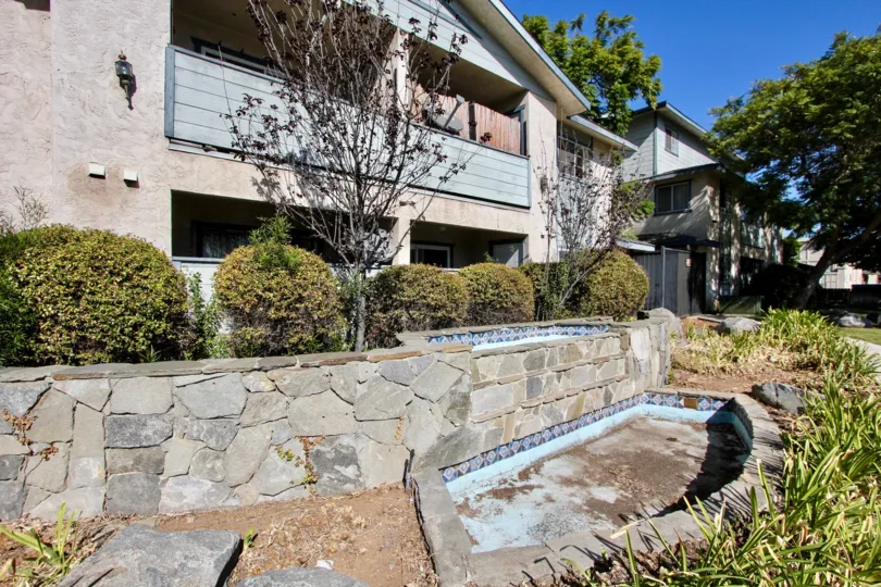 The outside ground view of Gentry Villas, Chula Vista, CA showing fountains.