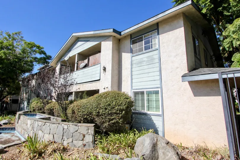 A sunny day casting shadows from the trees on Gentry Villas in Chula Vista, California