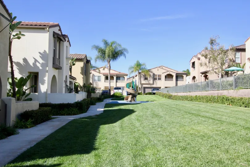 The green in between Houses at Gold Rush with the playground in the middle
