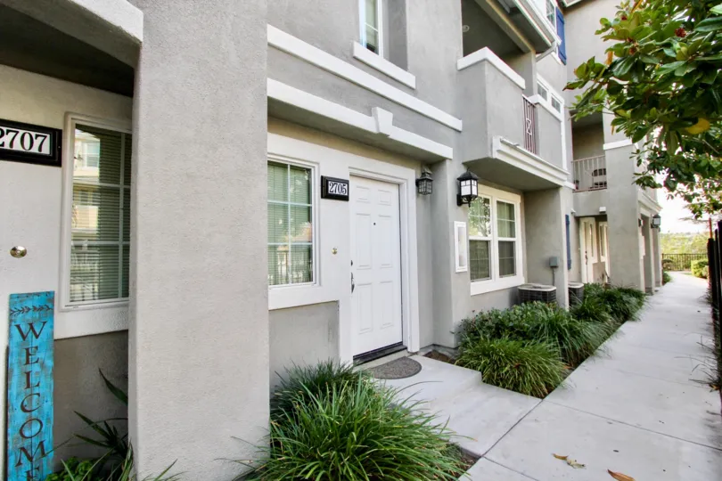 Condominiums with address signs beside their front doors at Greystone at Chula Vista CA
