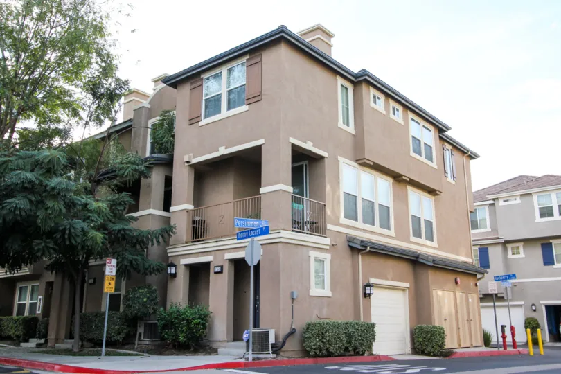 Some apartments on the corner of the street in the Greystone community in Chula Vista, California
