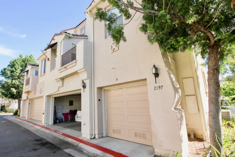A townhouse with covered garages in the Hearthstone Village community.
