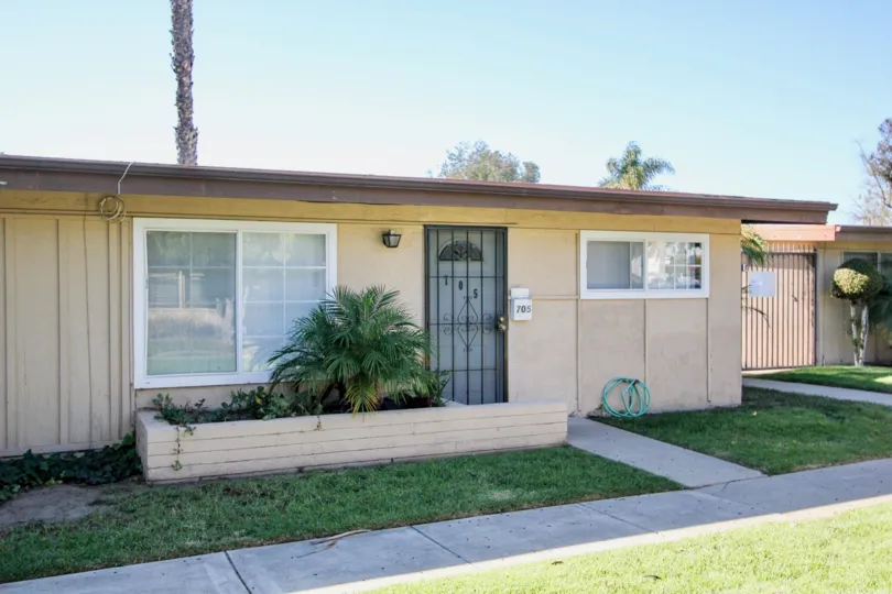 Single-story home at 705 Karen Condominiums in Chula Vista, CA with garden in front