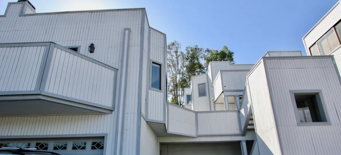 Multi-unit living spaces. Modernized housing units with clean lines and windows.