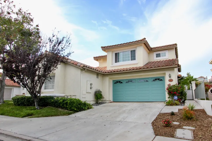 A sunny day in Chula Vista, CA in front of a Single residence home garage