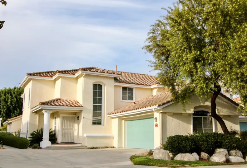Sunny day at a Spanish style home in the Masters collection Community in Chula Vista California