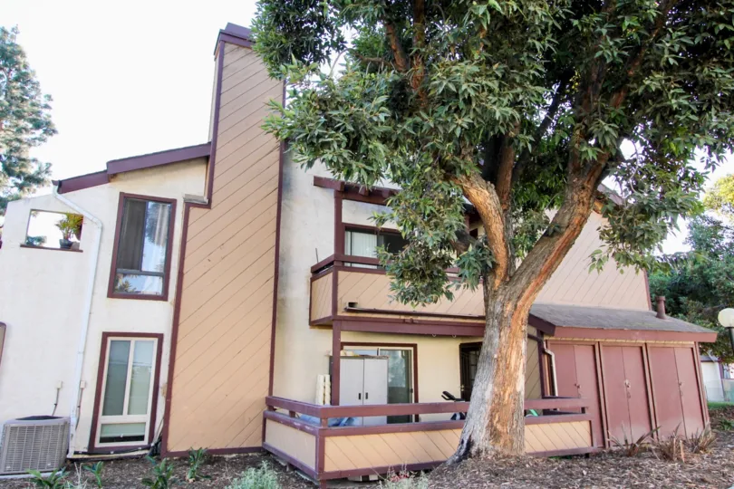 THE HOUSE IN THE MELROSE VILLAS WITH THE BICYCLE, TREE, FLOWER POT