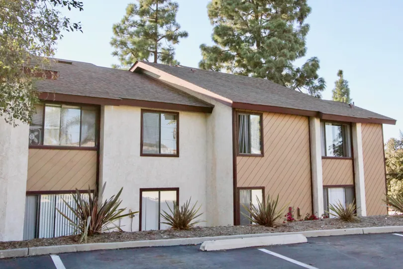Multi-unit lodging viewed from the parking lot at Melrose Villas in Chula Vista, CA