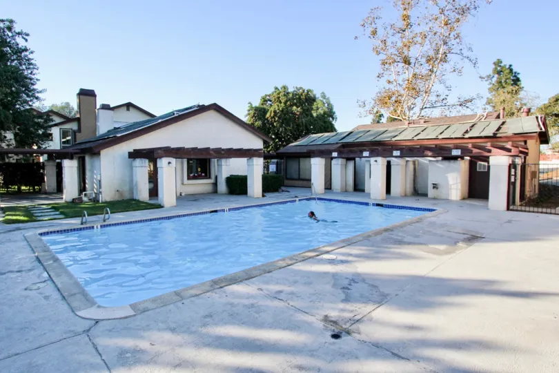 The provate swimming pool and exterior of some of the buildings at the Melrose Villas community.