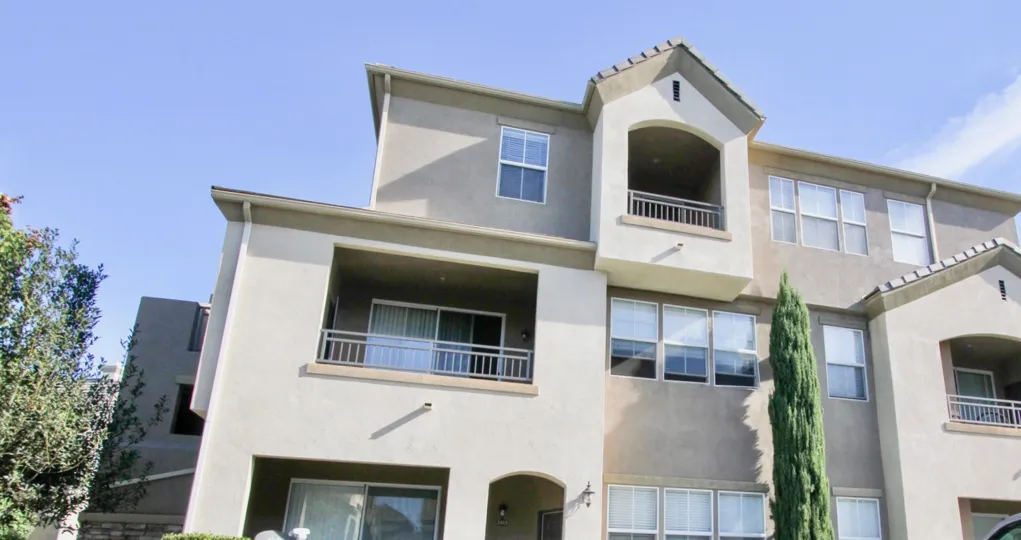 A sunny day in the area of Mer Soleil, condos, outside, balcont, trees, railing, windows
