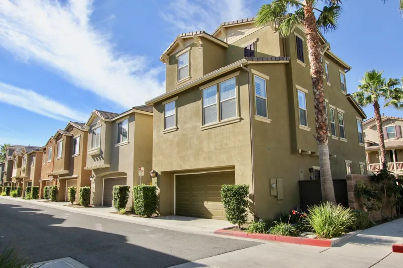 Neat hedges line the street in front of houses in the Mosaic community, in Chula Vista, CA.