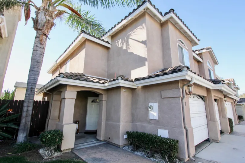 2 story duplex with garage and covered door entrance