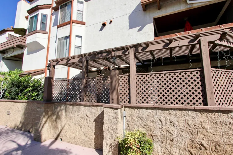 Side of apartment building with terrace patio at the Parkwoods in Chula, Vista, Ca.