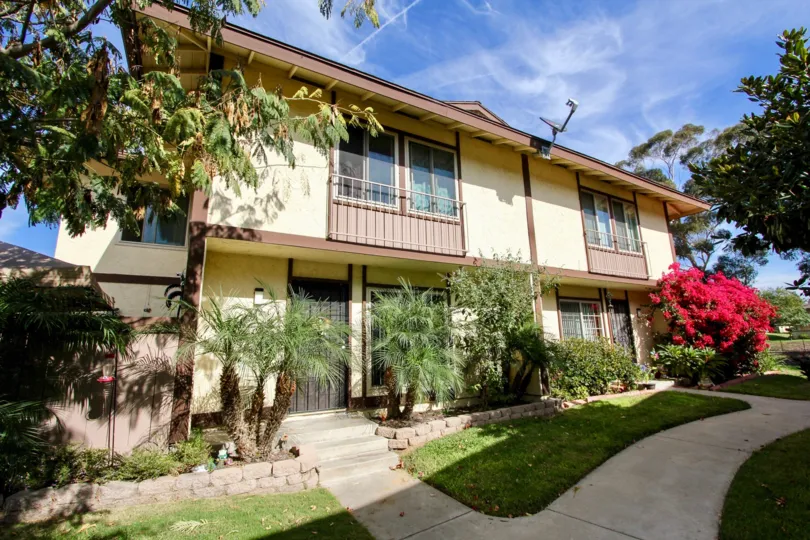 A sunny day in the Rancho Rios with many types of trees and the house at Chula Vista in California