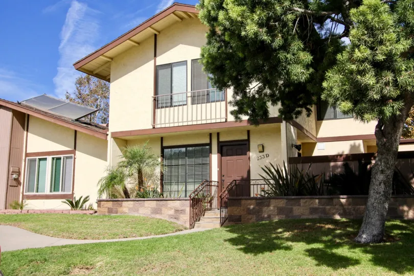 THE HOUSE CONSISTS OF A UPSTAIRS, TREE, PLANTS, LAWN IN THE RANCHO RIOS