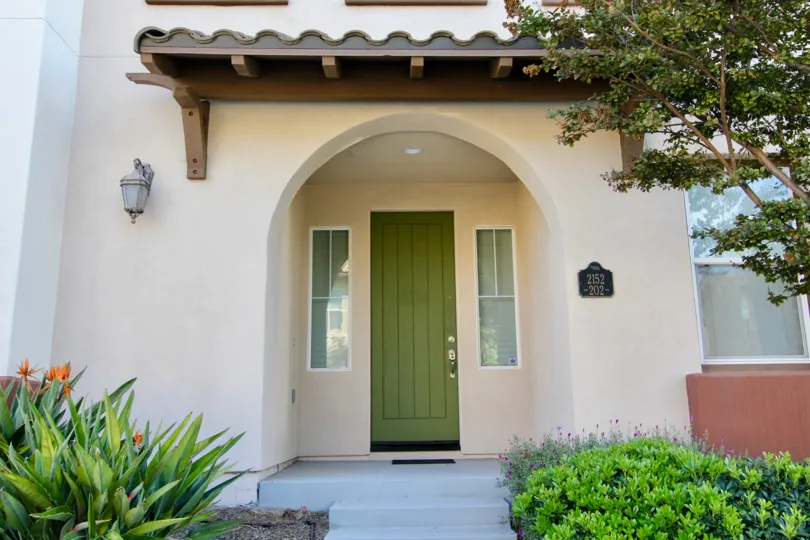 The front of the house in Saguaro with the green front door.