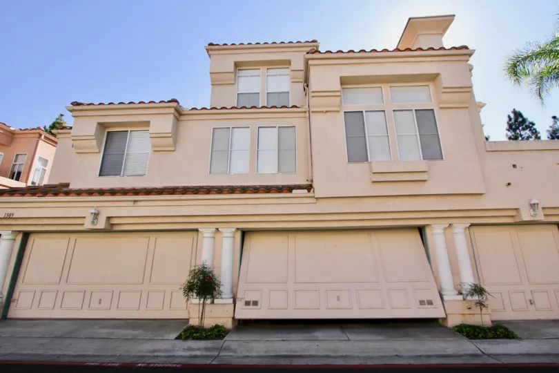 Garage door opening with a sunny sky in the Serena Condominiums Community in Chula Vista, CA.