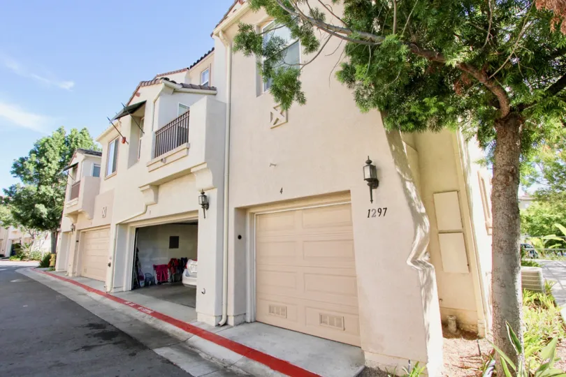Clean and clear garage have car parked in street view in Silver Sage