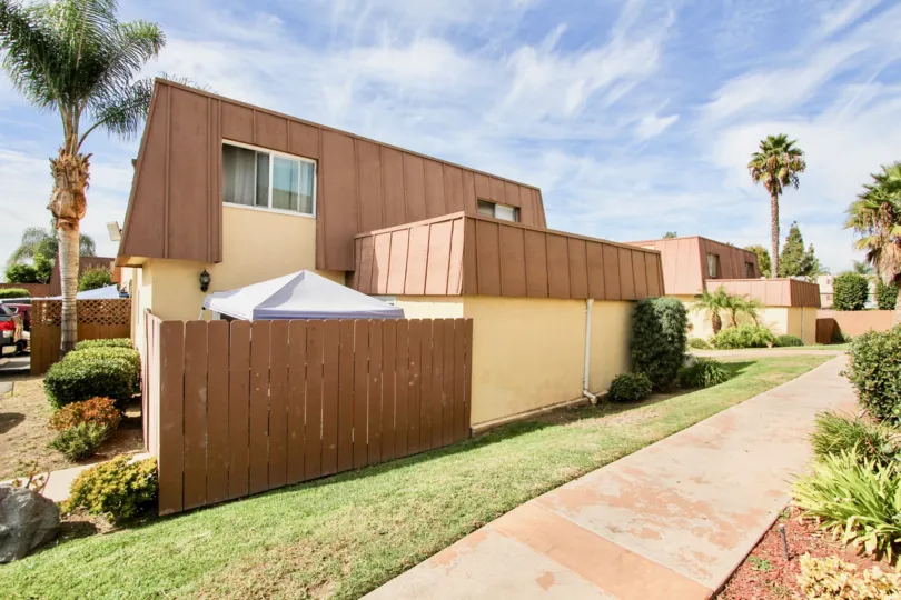 The view of a patio at the Stonebridge II Community from a path in sunny Chula Vista, CA