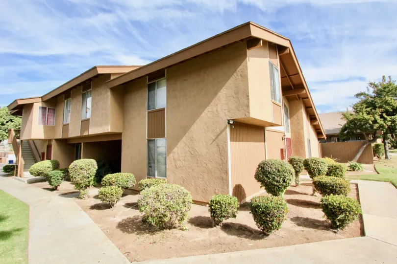 An orange housing apartment in Stonebridge, California on a sunny day.