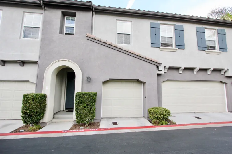 Two Garages and an entranceway of a summer hill home in Chula Vista