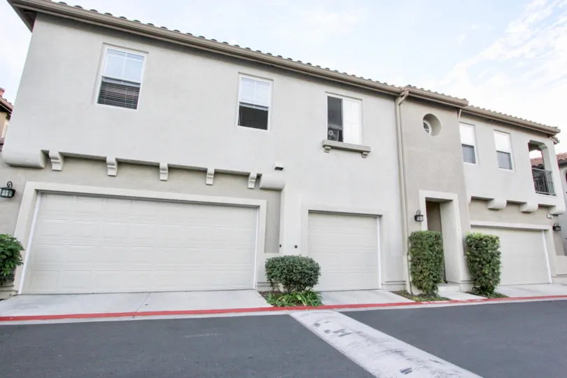 A sunny day in the area of Summer Hill, Outside, parking lot, garages, bushes, windows