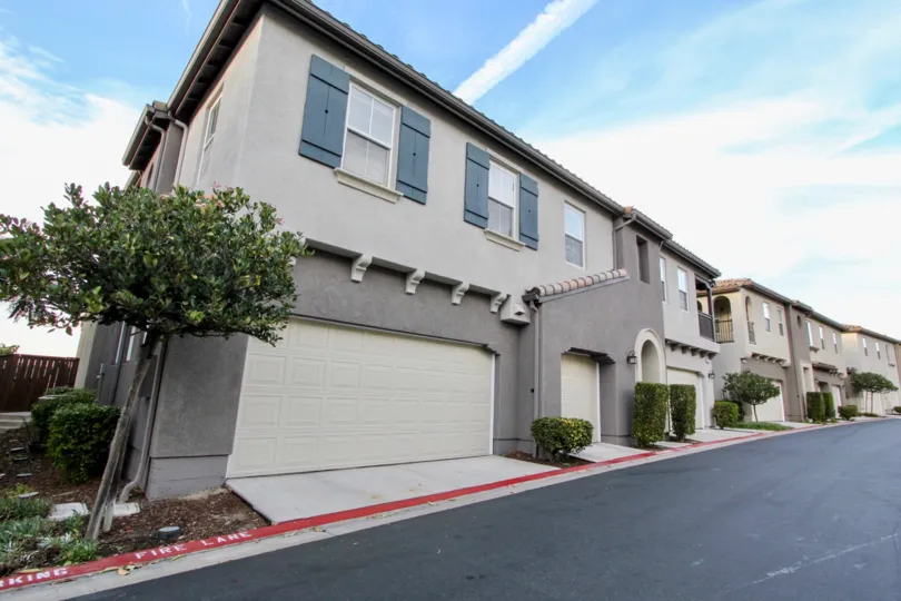 Summer Hill community side road with garage doors, Chula Vista, CA