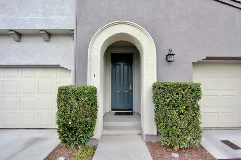 Front entrance door with trees in two sides in Summer Hill