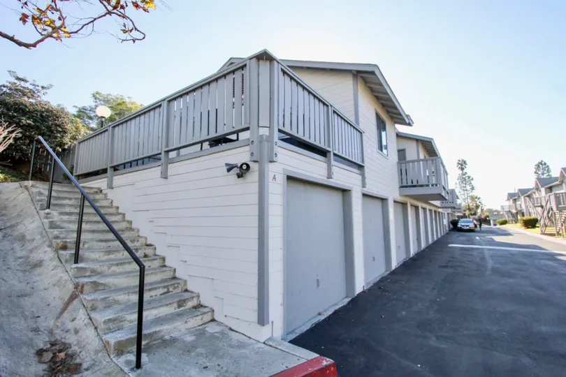 THE BUILDING IN THE SUMMERWIND WITH THE UPSTAIRS, CAR PARKING