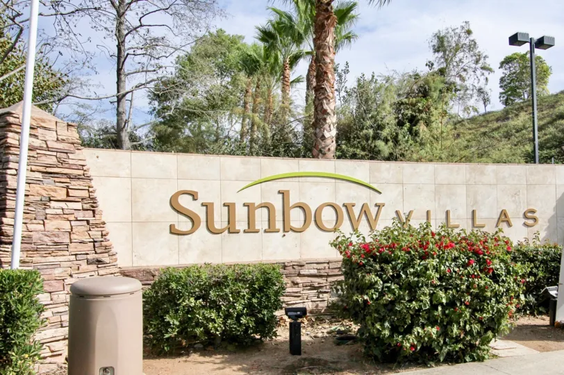 A large stone signage of the Sunbow Villas community.