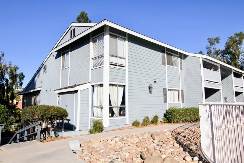 Front view of the building decorated with plants and stones in Telegraph Canyon Terrace