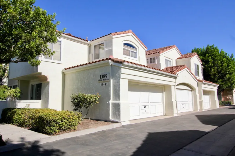 big white house with classic work and plenty of garage space and a nice surrounding