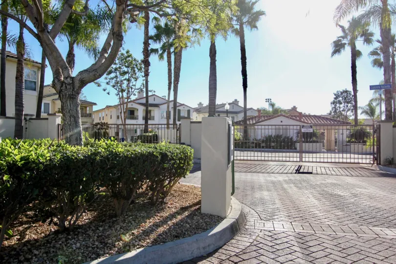 Entrance gate with tiles and garden in Tivoli Villas.