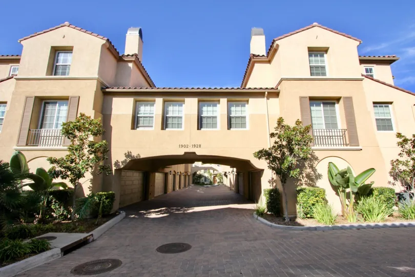 The front driveway of an apartment block in Chula Vista, with a view to the garages under the apartment block.