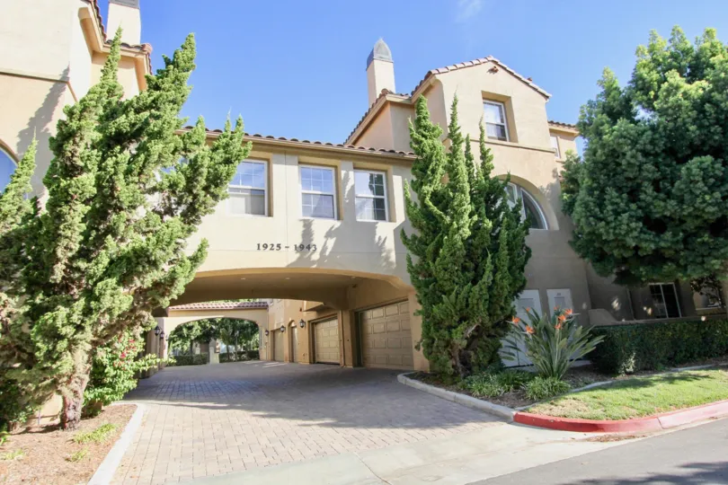 Sunny day front driving way with garage view in Treviana, Chula Vista, CA