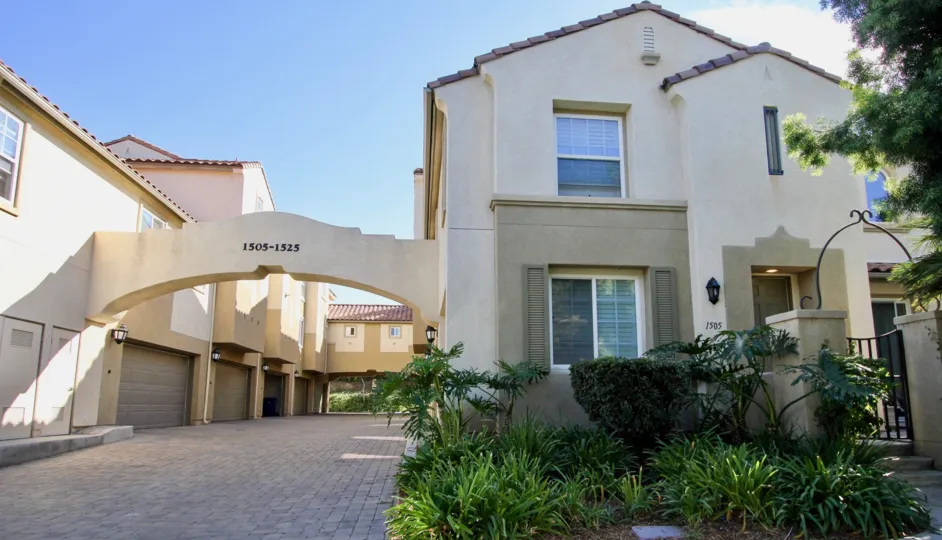 A sunny day in the area of Treviana, bushes, gate, door, condoe, driveway, garage