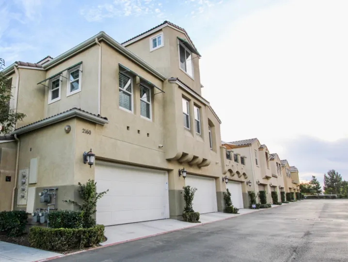 The exterior view of the garage and driveways of Veranza in Chula Vista