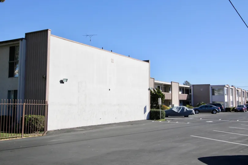 THE BUILDINGS IN THE VILLA CAMPESTRE WITH THE CAR PARKING, ROAD, STEEL GATE