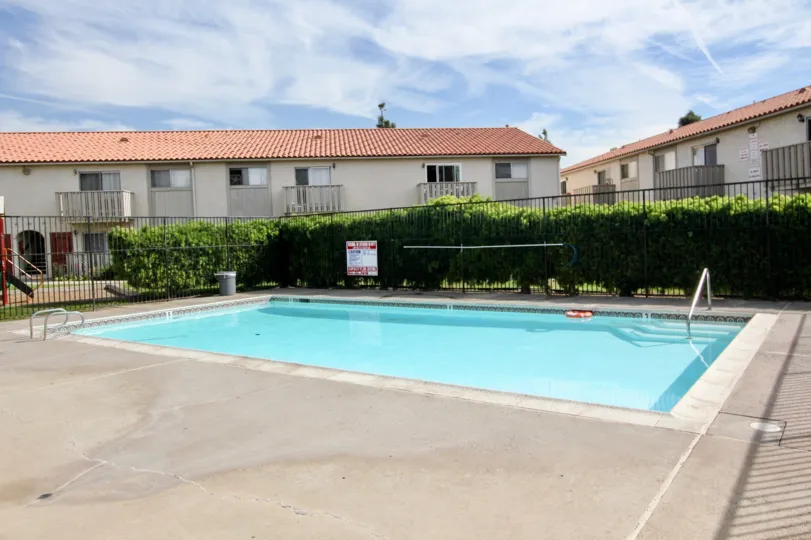 Swimming pool with wide area and railing in Villa De Anita.