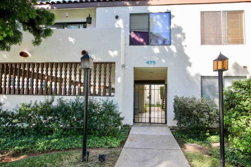 A pathway leading up to apartments with a closed gate in Chula Vista in California.