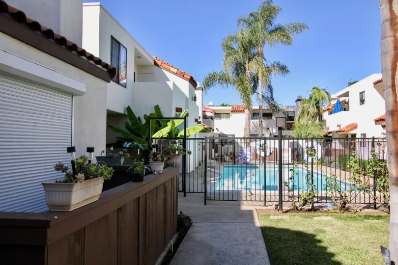 Two-storey residences in the Villa Hermosa community with gated pool.