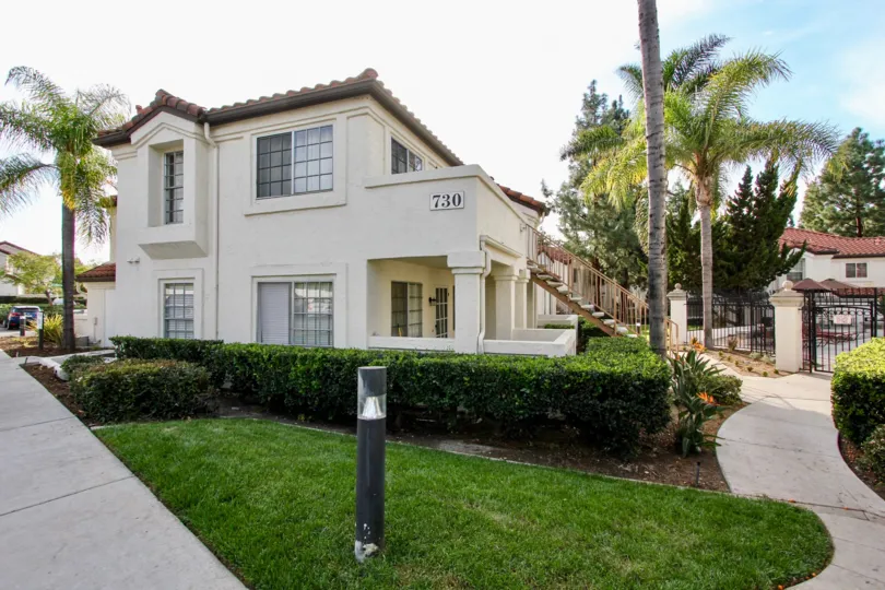 Side view of apartments with landscaping and trees at Villas Martinique in Chula Vista Ca.