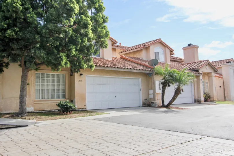 Sunny day side view with entry door and walkway, Villa Rosa Community, Chula Vista, CA