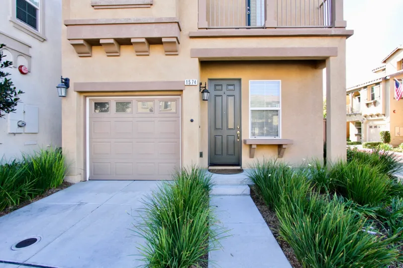 A look at the front entrance of a Town house complete with one car garage at the Villas De Avila Community in Chula Vista, CA