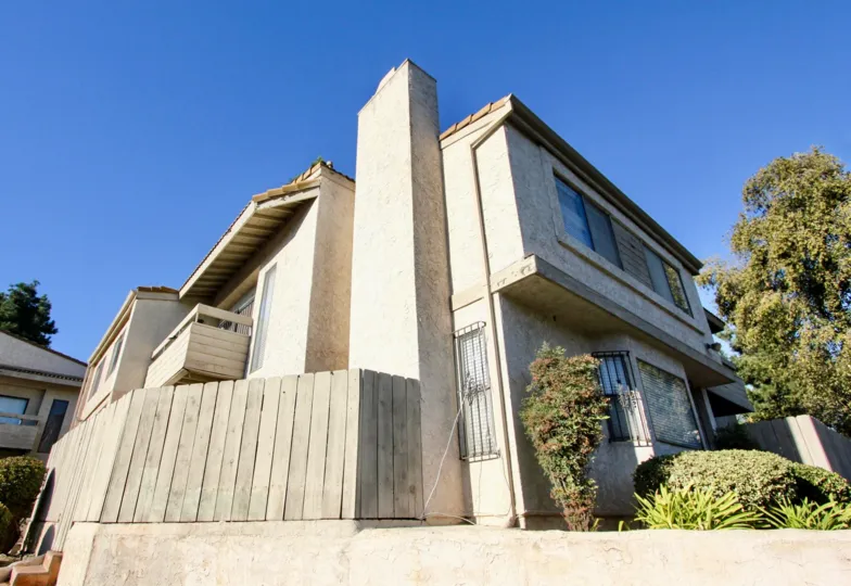 A side view of a Vista De Otay grey home in Chula Vista, CA.