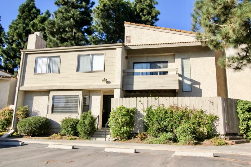 A Bright sunny day with trees around in front of villa in Vista De Otay of Chula Vista