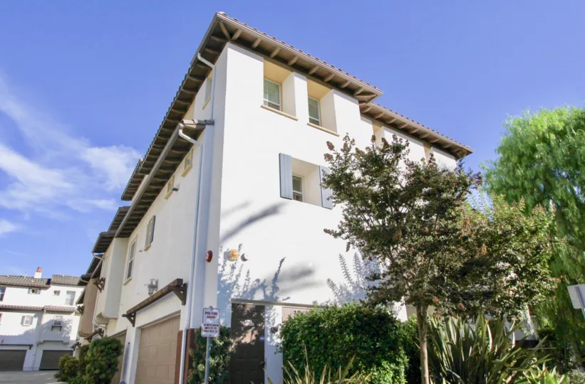 Bright sunshine on white building with slant roof in Winding Walk.