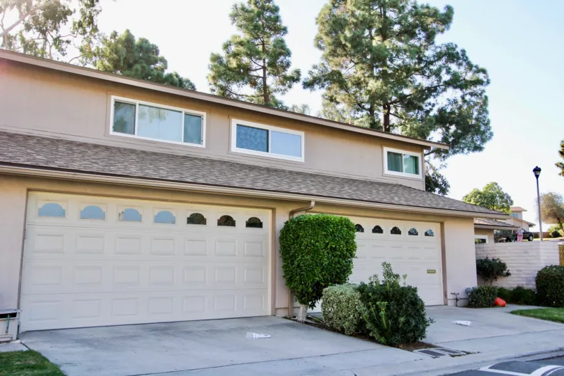 A house with two garages in a shade setting at Windsor Heights.