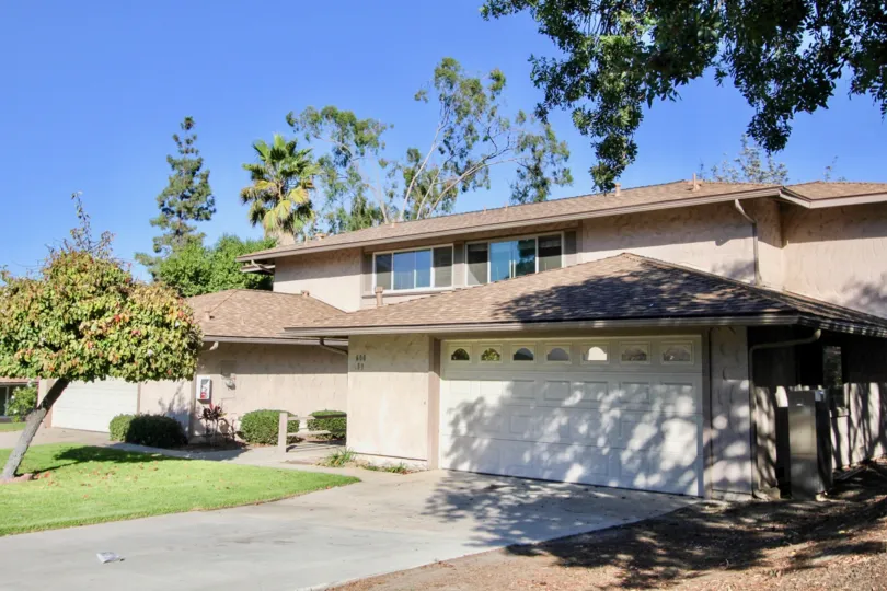 nice big house surrounded by lush greenery and very clear and lovely day in Windsor Heights, chula vista