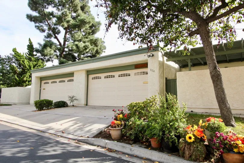 A cream and green double garage in the Windsor View community